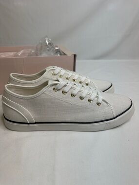 JustFab White Low-Top Canvas Sneakers with Gold Eyelets and Black Trim